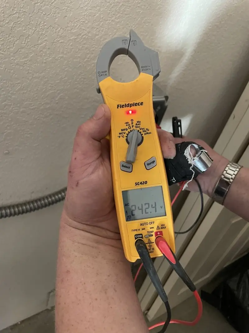 Voltage testing with clamp meter during Ceiling Fan Installation in Melvindale